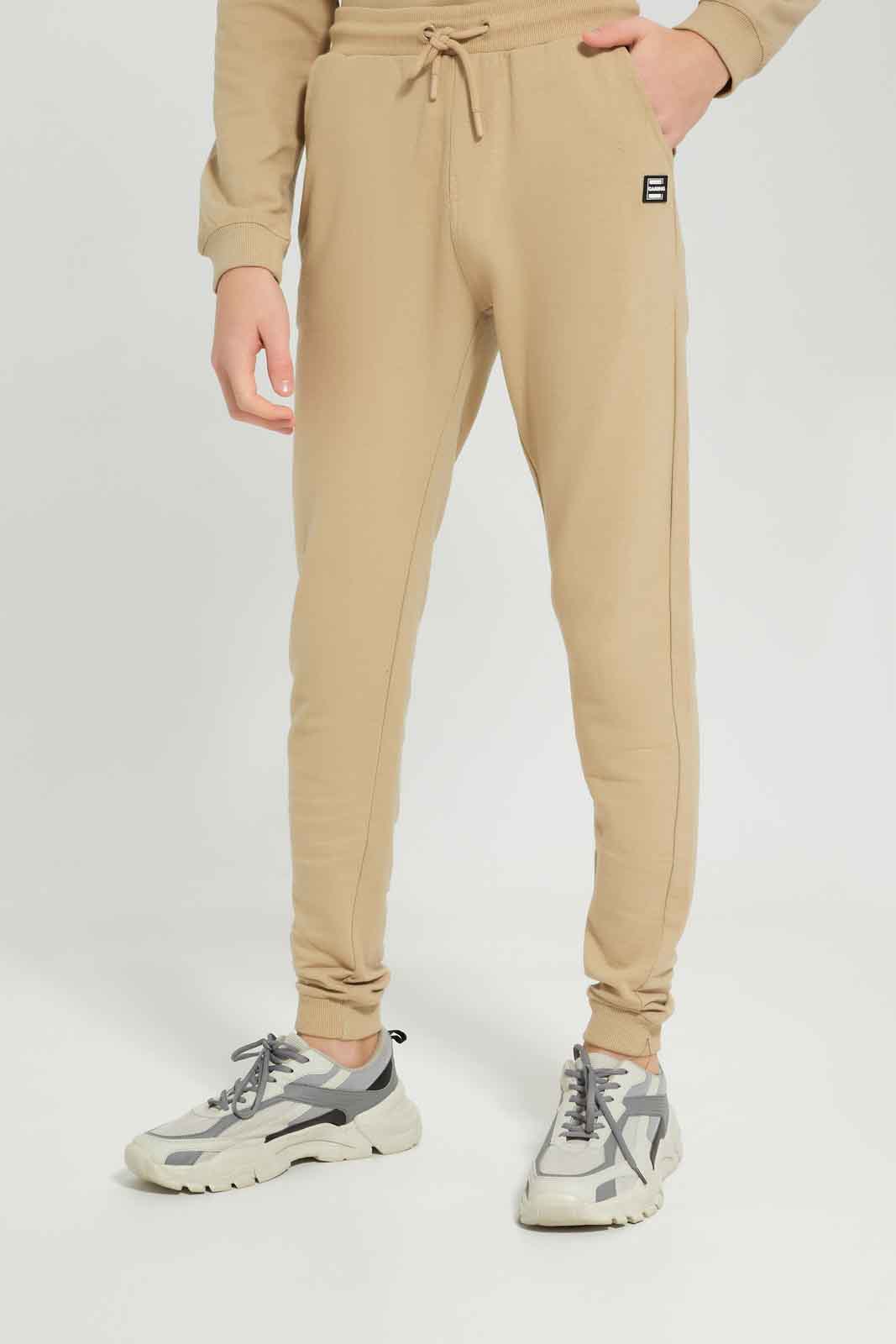 Redtag-Boys-Beige-Gamer-Jogsuit-BSR-Jog-Sets,-Category:Jog-Sets,-Colour:Beige,-Deals:New-In,-Dept:Boys,-Filter:Senior-Boys-(8-to-14-Yrs),-New-In-BSR-APL,-Non-Sale,-S23A,-Section:Boys-(0-to-14Yrs)-Senior-Boys-9 to 14 Years