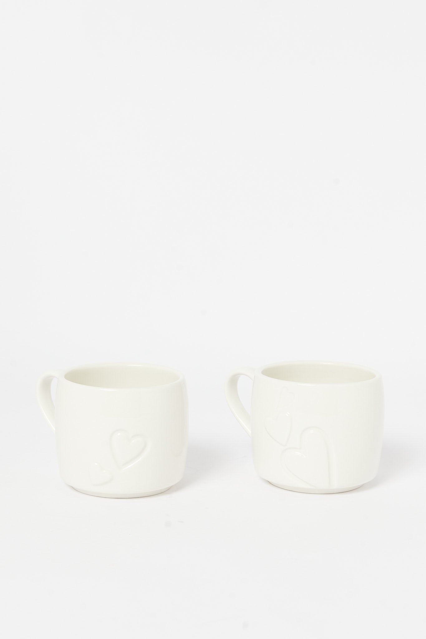 Redtag-Gold-Embossed-Stackable-Heart-Mug-(2-Piece)-Category:Cups-&-Mugs,-Colour:Gold,-Deals:New-In,-Dept:Home,-Filter:Home-Dining,-H1:HMW,-H2:DIN,-H3:CRC,-H4:CCS,-HMW-DIN-Crockery,-New-In-HMW-DIN,-Non-Sale,-S23A,-Season:S23A,-Section:Homewares-Home-Dining-