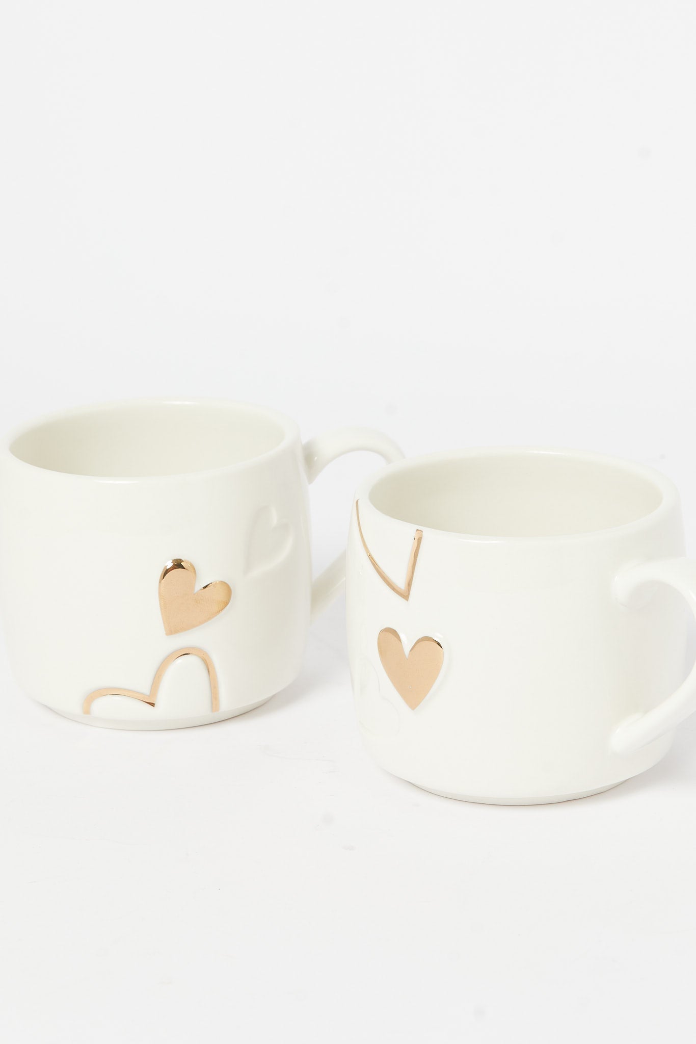 Redtag-Gold-Embossed-Stackable-Heart-Mug-(2-Piece)-Category:Cups-&-Mugs,-Colour:Gold,-Deals:New-In,-Dept:Home,-Filter:Home-Dining,-H1:HMW,-H2:DIN,-H3:CRC,-H4:CCS,-HMW-DIN-Crockery,-New-In-HMW-DIN,-Non-Sale,-S23A,-Season:S23A,-Section:Homewares-Home-Dining-