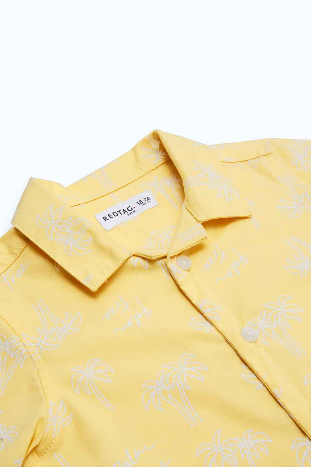 Redtag-Boys-Yellow-Aop-Palm-Tree-Ss-Shirt-Category:Shirts,-Colour:Yellow,-Deals:New-In,-Dept:Boys,-Filter:Infant-Boys-(3-to-24-Mths),-INB-Shirts,-New-In-INB-APL,-Non-Sale,-S23B,-Section:Boys-(0-to-14Yrs)-Infant-Boys-3 to 24 Months
