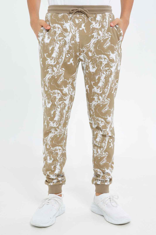 Redtag-Boys-Beige-Marble-Print-Active-Pants-BSR-Joggers,-Category:Joggers,-Colour:Beige,-Deals:New-In,-Dept:Boys,-Filter:Senior-Boys-(8-to-14-Yrs),-New-In-BSR-APL,-Non-Sale,-S23B,-Section:Boys-(0-to-14Yrs)-Senior-Boys-9 to 14 Years