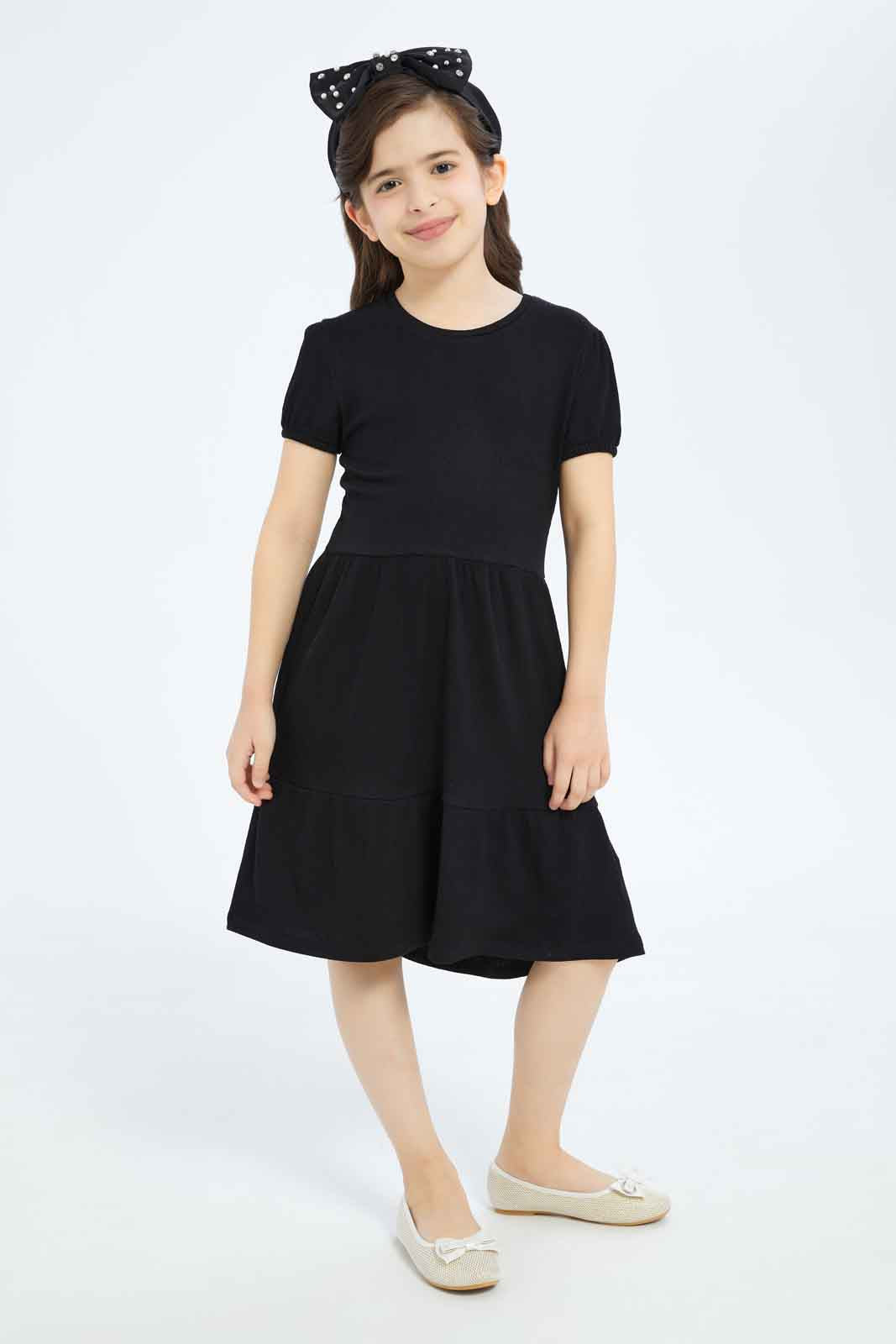Redtag-Girls-Textured-Knit-Trapeze-Dress---Black-Category:Dresses,-Colour:Black,-Deals:New-In,-Dept:Girls,-Filter:Girls-(2-to-8-Yrs),-GIR-Dresses,-New-In-GIR-APL,-Non-Sale,-S23B,-Section:Girls-(0-to-14Yrs)-Girls-2 to 8 Years