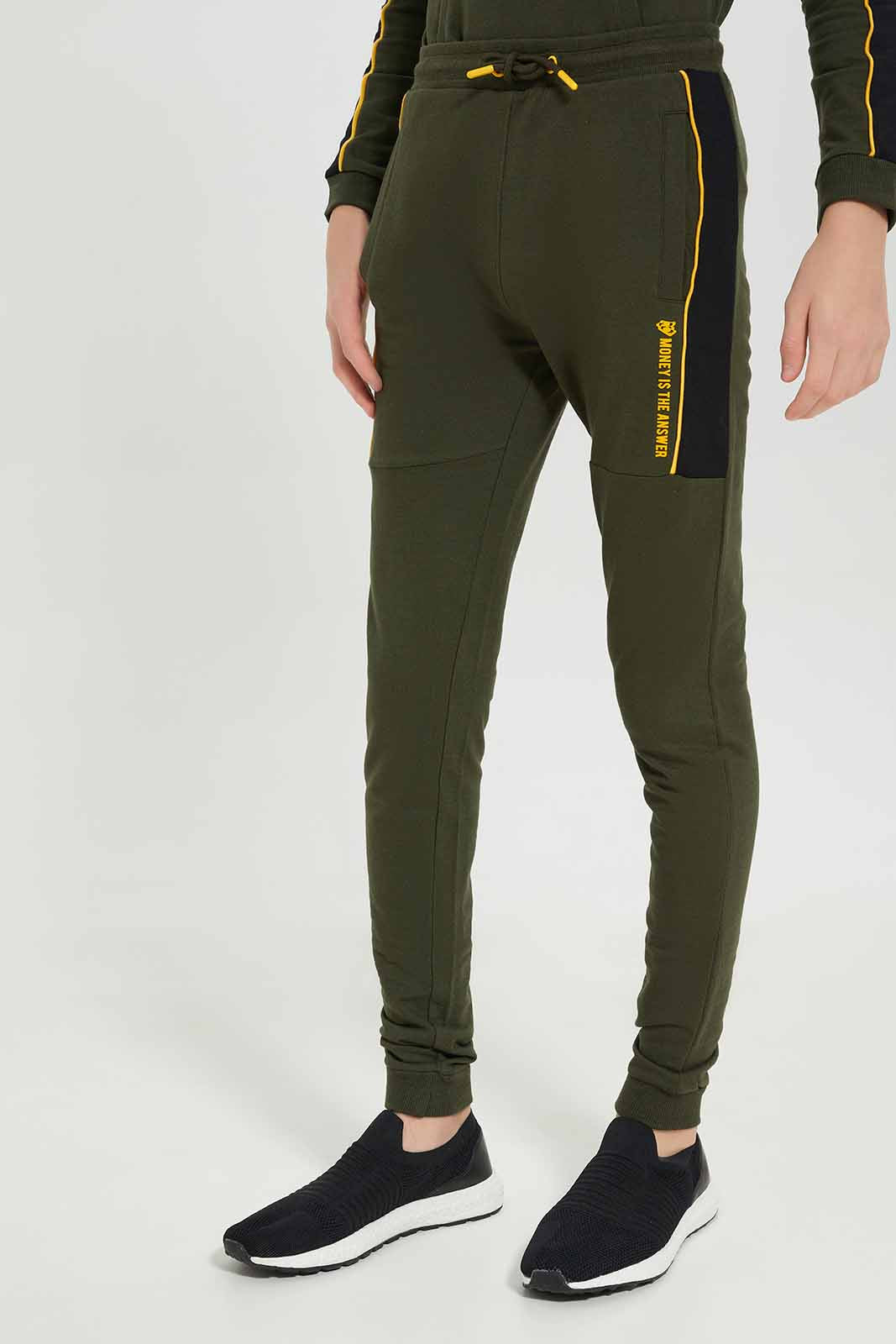 Redtag-Boys-Olive-Everything-Needs-Money-Jogsuit-BSR-Jog-Sets,-Category:Jog-Sets,-Colour:Olive,-Deals:New-In,-Dept:Boys,-Filter:Senior-Boys-(8-to-14-Yrs),-New-In-BSR-APL,-Non-Sale,-S23A,-Section:Boys-(0-to-14Yrs)-Senior-Boys-9 to 14 Years