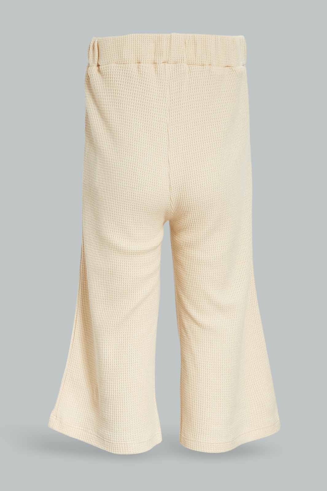 Redtag-Girls-Cream-Wide-Leg-Waffle-Trouser-Category:Trousers,-Colour:Cream,-Deals:New-In,-Dept:Girls,-Filter:Infant-Girls-(3-to-24-Mths),-ING-Trousers,-New-In-ING-APL,-Non-Sale,-S23A,-Section:Girls-(0-to-14Yrs)-Infant-Girls-3 to 24 Months
