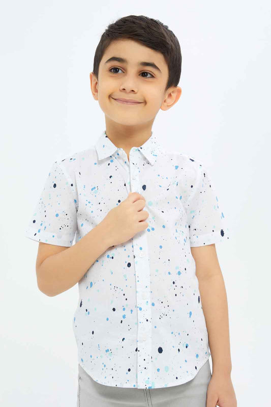 Redtag-Boys-White-Paint-Splat-Short-Sleeve-Shirt-BOY-Shirts,-Category:Shirts,-Colour:White,-Deals:New-In,-Dept:Boys,-Filter:Boys-(2-to-8-Yrs),-New-In-BOY-APL,-Non-Sale,-S23C,-Section:Boys-(0-to-14Yrs)-Boys-2 to 8 Years