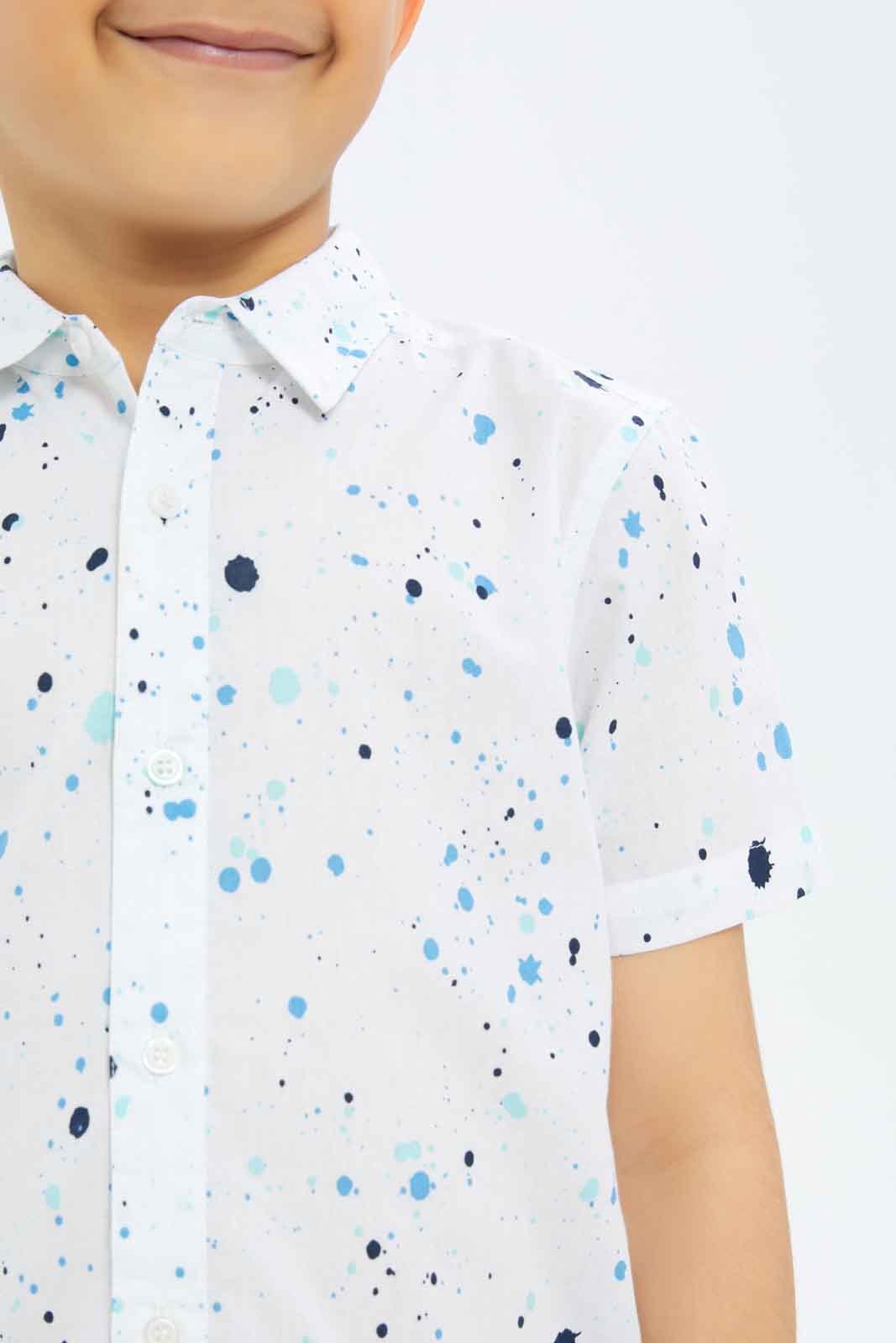 Redtag-Boys-White-Paint-Splat-Short-Sleeve-Shirt-BOY-Shirts,-Category:Shirts,-Colour:White,-Deals:New-In,-Dept:Boys,-Filter:Boys-(2-to-8-Yrs),-New-In-BOY-APL,-Non-Sale,-S23C,-Section:Boys-(0-to-14Yrs)-Boys-2 to 8 Years