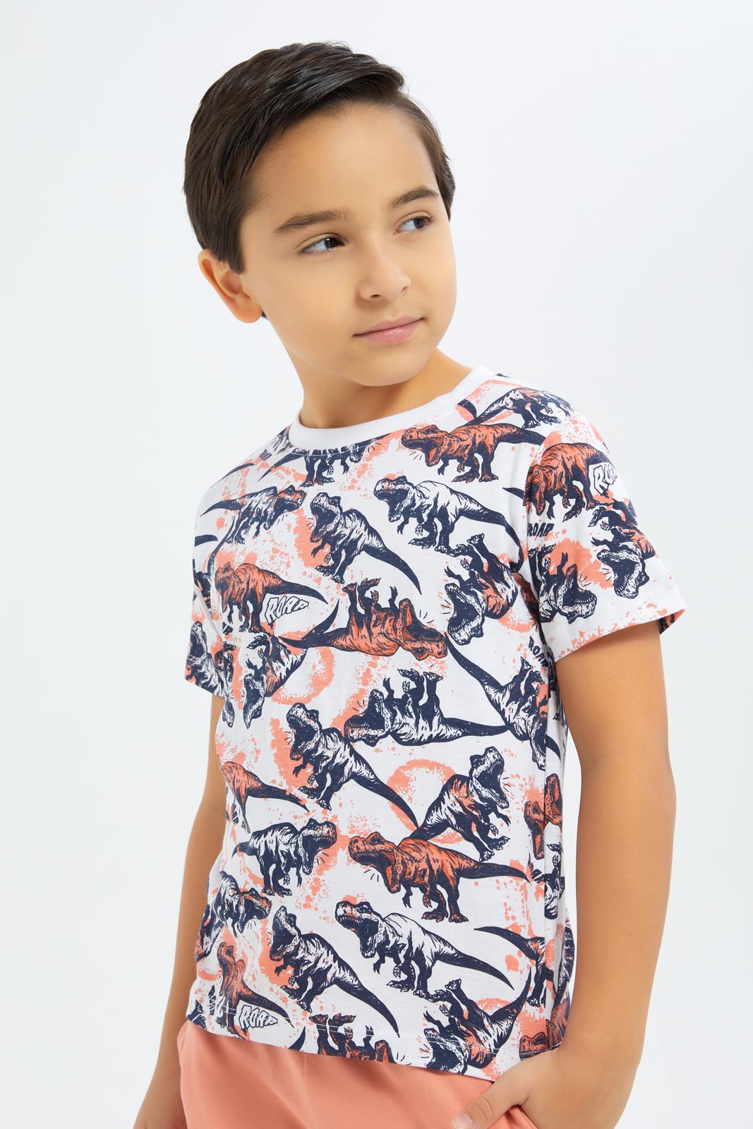 Redtag-Boys-Coral-Dino-Print-T-Shirt-And-Shorts-Set-BOY-Sets,-Category:Sets,-Colour:Red,-Deals:New-In,-Dept:Boys,-Filter:Boys-(2-to-8-Yrs),-New-In-BOY-APL,-Non-Sale,-S23B,-Section:Boys-(0-to-14Yrs)-Boys-2 to 8 Years
