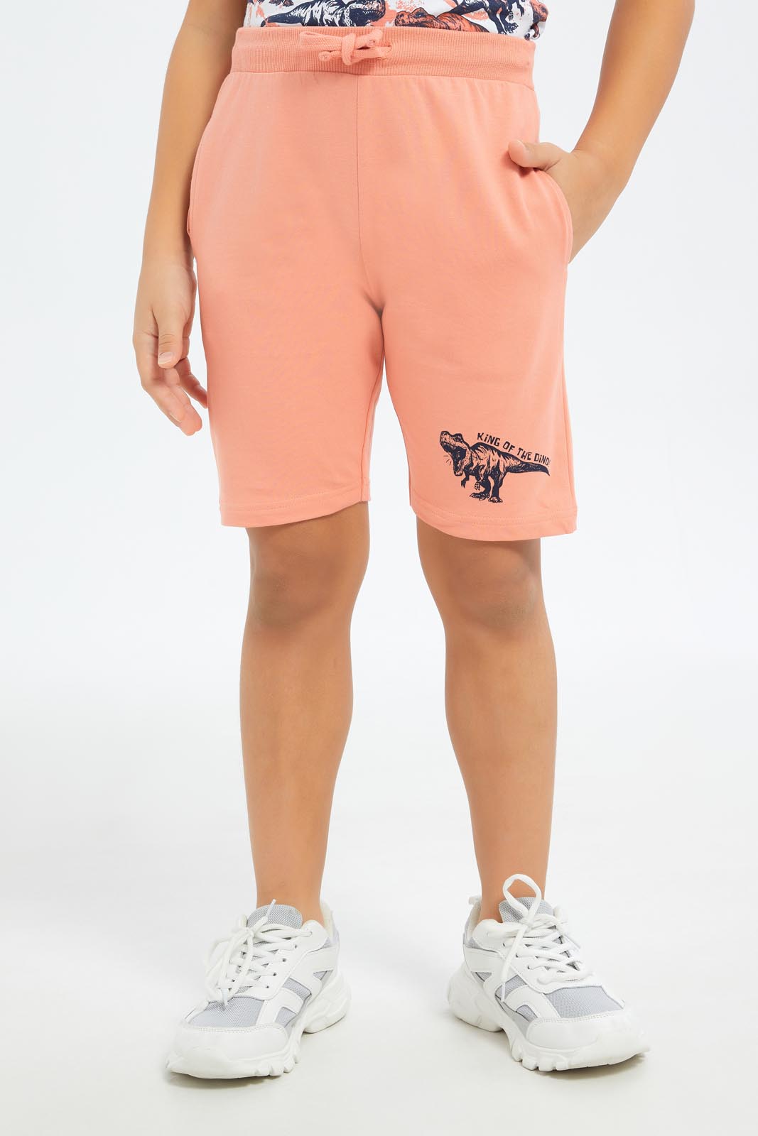 Redtag-Boys-Coral-Dino-Print-T-Shirt-And-Shorts-Set-BOY-Sets,-Category:Sets,-Colour:Red,-Deals:New-In,-Dept:Boys,-Filter:Boys-(2-to-8-Yrs),-New-In-BOY-APL,-Non-Sale,-S23B,-Section:Boys-(0-to-14Yrs)-Boys-2 to 8 Years