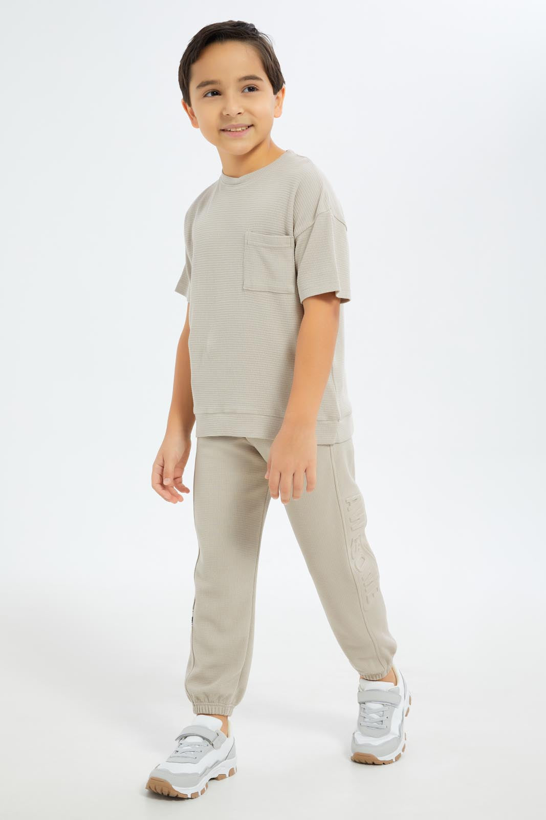 Redtag-Boys-Beige-Over-Size-Waffle-T-Shirt-BOY-T-Shirts,-Category:T-Shirts,-CHA,-Colour:Beige,-Deals:New-In,-Dept:Boys,-Filter:Boys-(2-to-8-Yrs),-New-In-BOY-APL,-Non-Sale,-S23C,-Section:Boys-(0-to-14Yrs)-Boys-2 to 8 Years