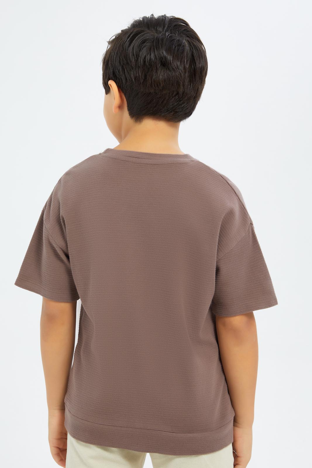 Redtag-Boys-Brown-Over-Size-Waffle-T-Shirt-BOY-T-Shirts,-Category:T-Shirts,-CHA,-Colour:Brown,-Deals:New-In,-Dept:Boys,-Filter:Boys-(2-to-8-Yrs),-New-In-BOY-APL,-Non-Sale,-S23C,-Section:Boys-(0-to-14Yrs)-Boys-2 to 8 Years