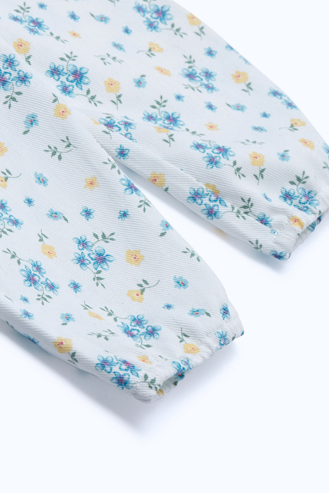 Redtag-Girls-Ivory-Floral-Aop-Denim-Jumpsuit-Category:Jumpsuits,-Colour:Ivory,-Deals:New-In,-Dept:Girls,-Filter:Infant-Girls-(3-to-24-Mths),-ING-Jumpsuits,-New-In-ING-APL,-Non-Sale,-S23B,-Section:Girls-(0-to-14Yrs)-Infant-Girls-3 to 24 Months