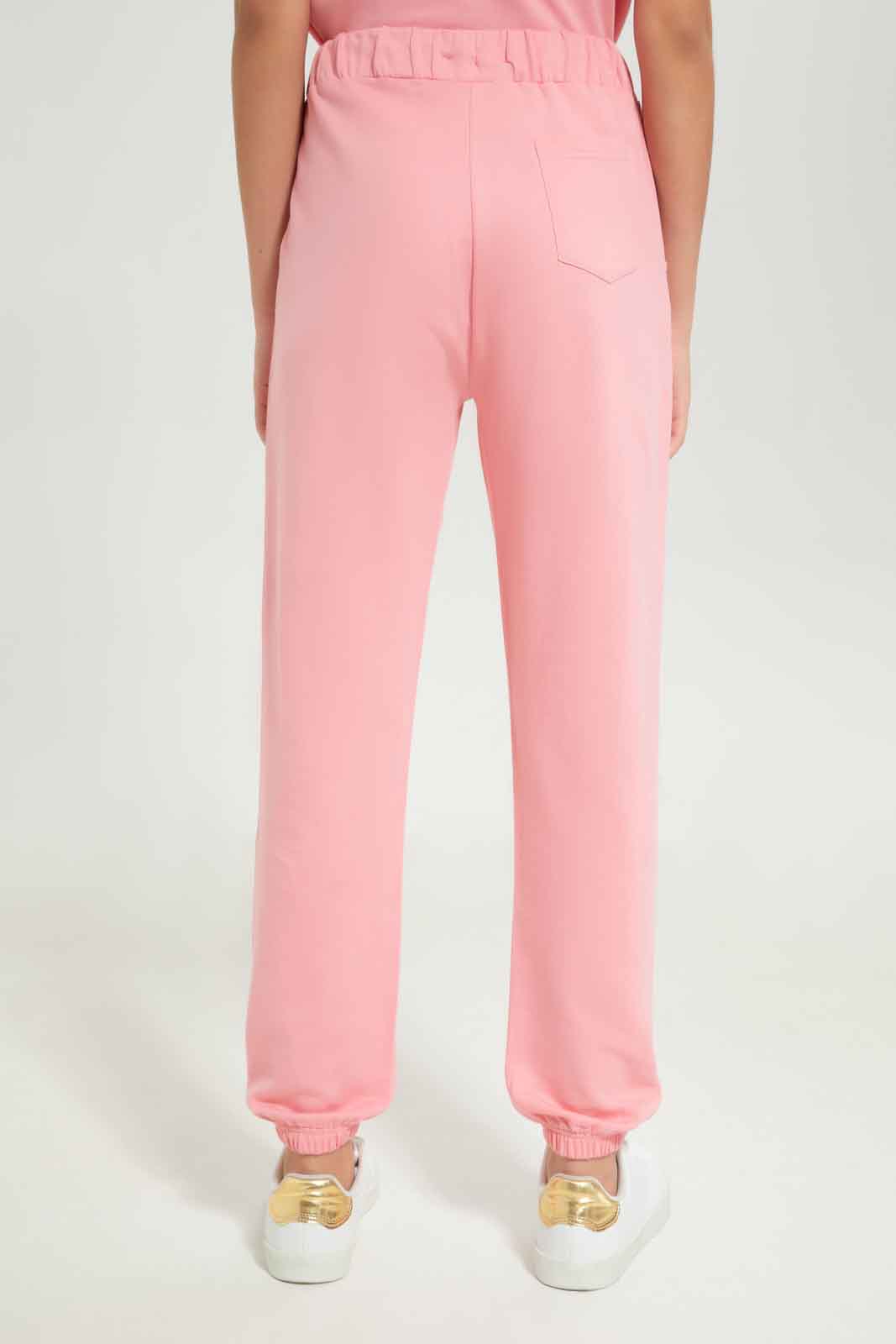 Redtag-Girls-Pink-Jogger-Category:Joggers,-Colour:Apricot,-Deals:New-In,-Dept:Girls,-Filter:Senior-Girls-(8-to-14-Yrs),-GSR-Joggers,-New-In-GSR-APL,-Non-Sale,-S23B,-Section:Girls-(0-to-14Yrs)-Senior-Girls-9 to 14 Years