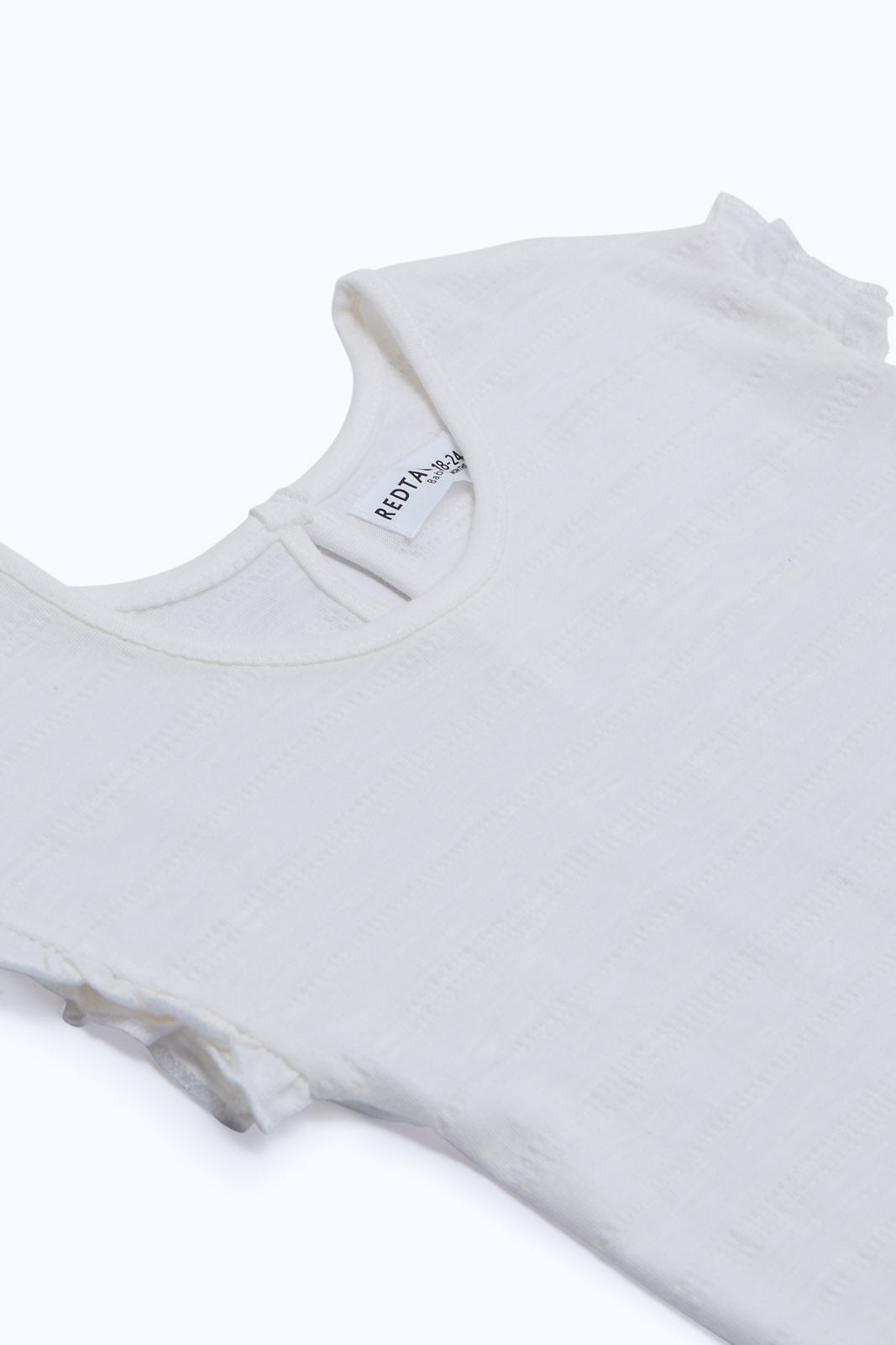 Redtag-Girls-White-Textured-T-Shirt-Category:T-Shirts,-Colour:White,-Deals:New-In,-Dept:Girls,-Filter:Infant-Girls-(3-to-24-Mths),-ING-T-Shirts,-New-In-ING-APL,-Non-Sale,-S23B,-Section:Girls-(0-to-14Yrs)-Infant-Girls-3 to 24 Months