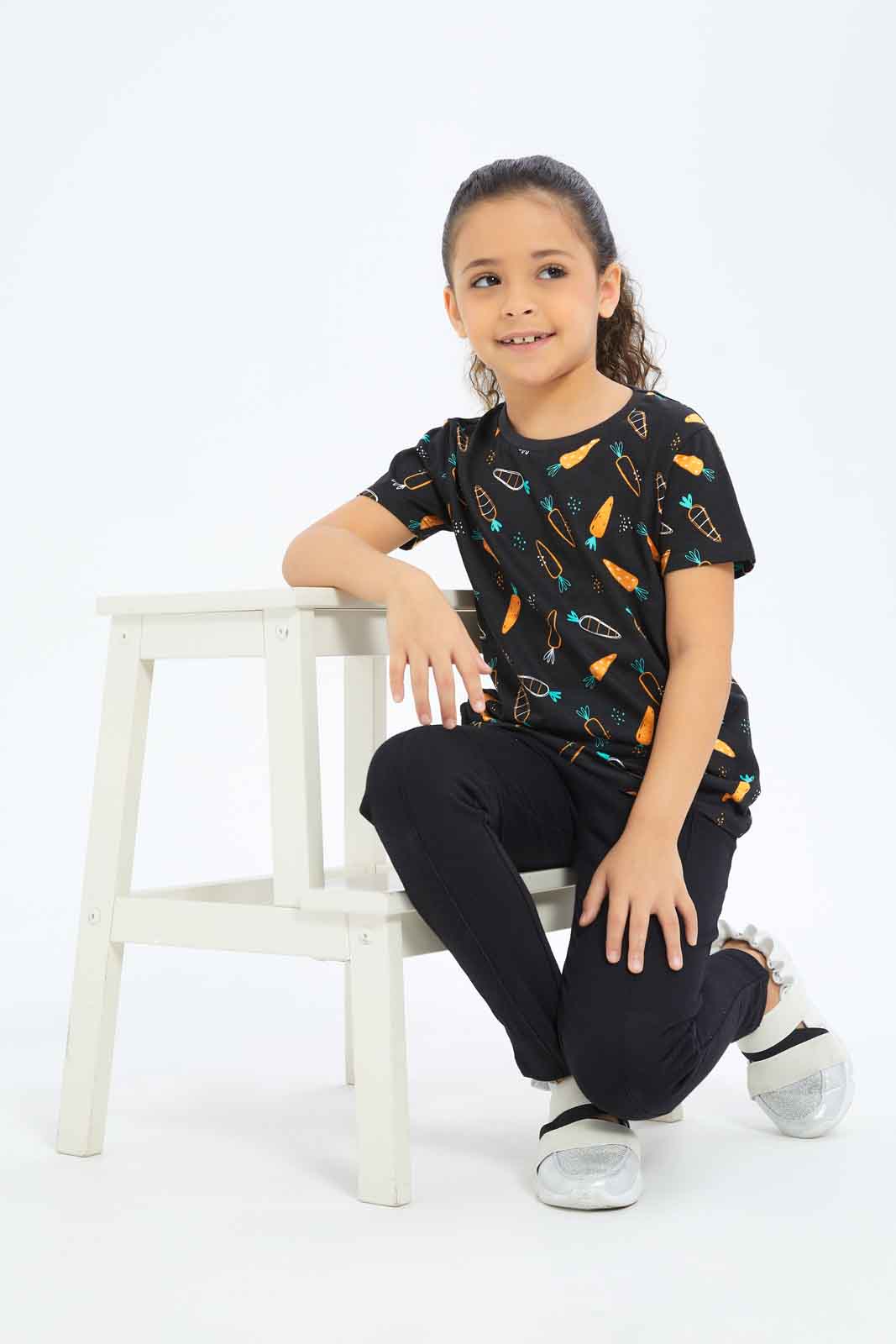 Redtag-Girls-Black-All-Over-Print-Tee-Category:T-Shirts,-Colour:Black,-Deals:New-In,-Dept:Girls,-Filter:Girls-(2-to-8-Yrs),-GIR-T-Shirts,-New-In-GIR-APL,-Non-Sale,-S23B,-Section:Girls-(0-to-14Yrs),-TBL-Girls-2 to 8 Years