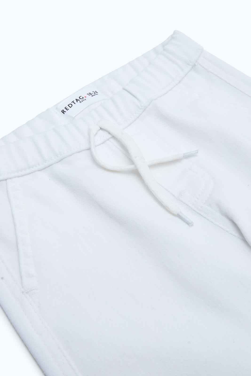 Redtag-Boys-White-Jogger-Jean-Category:Jeans,-Colour:White,-Deals:New-In,-Dept:Boys,-Filter:Infant-Boys-(3-to-24-Mths),-INB-Jeans,-New-In-INB-APL,-Non-Sale,-S23B,-Section:Boys-(0-to-14Yrs)-Infant-Boys-3 to 24 Months