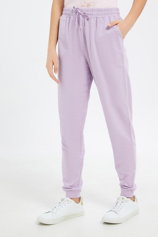 Redtag-Girls-Purple-Basic-Track-Pants-Category:Joggers,-Colour:Purple,-Deals:New-In,-Dept:Girls,-Filter:Senior-Girls-(8-to-14-Yrs),-GSR-Joggers,-H1:KWR,-H2:GSR,-H3:SPW,-H4:ATP,-New-In-GSR-APL,-Non-Sale,-S23C,-Season:S23C,-Section:Girls-(0-to-14Yrs),-TBL-Senior-Girls-9 to 14 Years