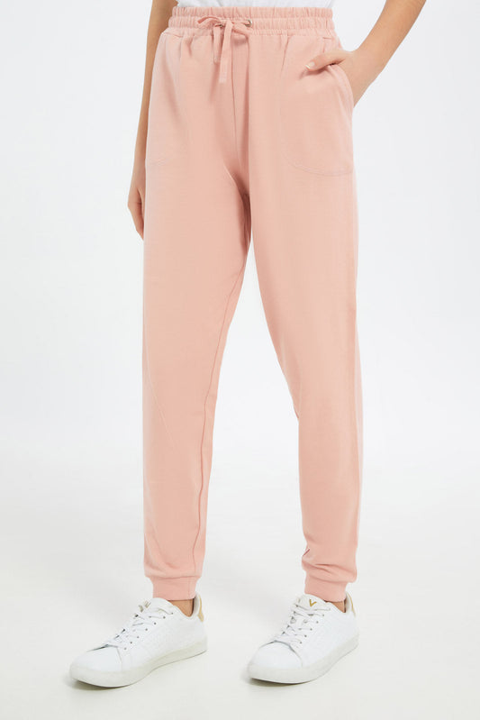 Redtag-Girls-Blush-Basic-Track-Pants-Category:Joggers,-Colour:Apricot,-Deals:New-In,-Dept:Girls,-Filter:Senior-Girls-(8-to-14-Yrs),-GSR-Joggers,-H1:KWR,-H2:GSR,-H3:SPW,-H4:ATP,-New-In-GSR-APL,-Non-Sale,-S23C,-Season:S23C,-Section:Girls-(0-to-14Yrs),-TBL-Senior-Girls-9 to 14 Years