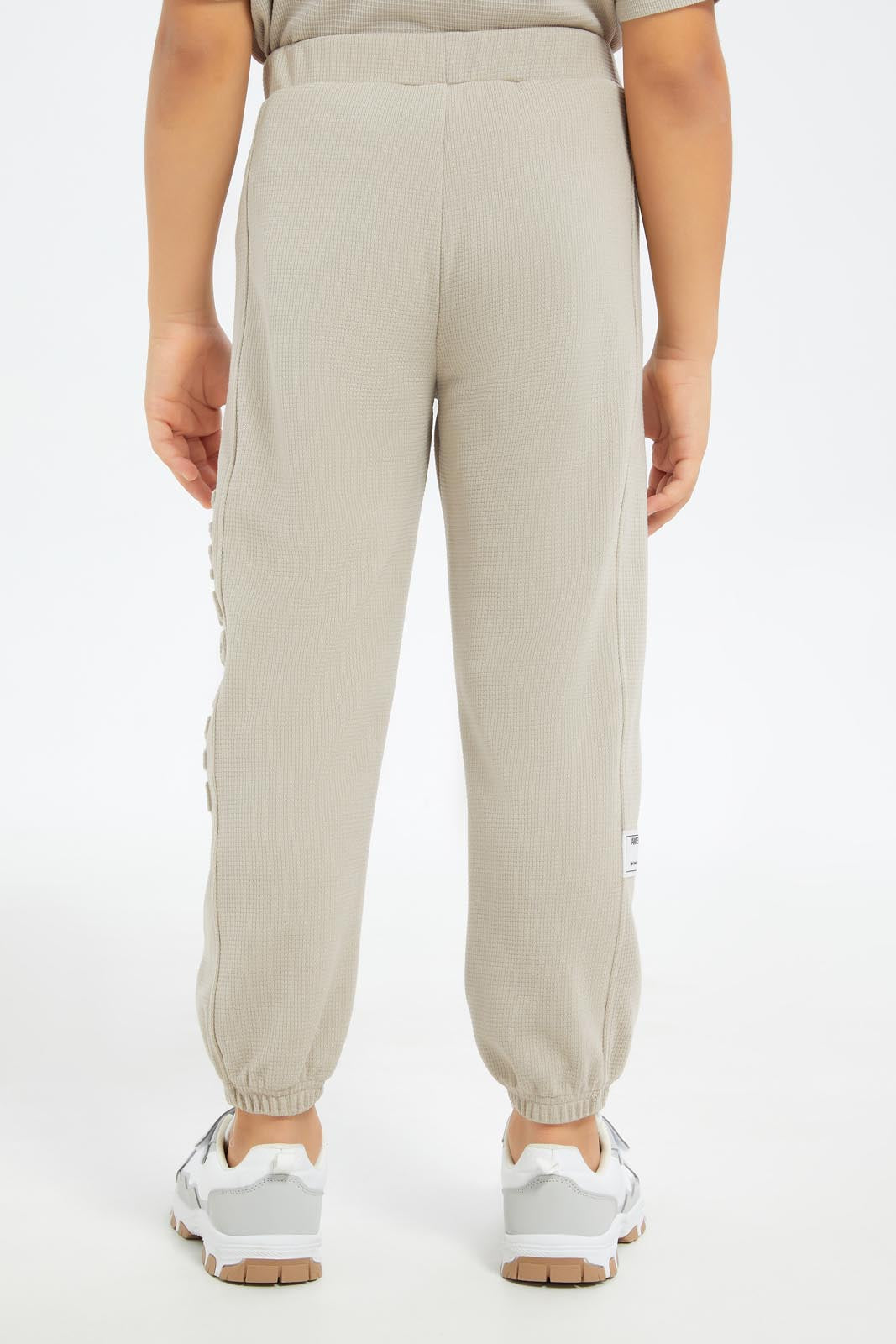 Redtag-Boys-Beige-Pique-Jaquard-Embosed-Track-Pant-BOY-Joggers,-Category:Joggers,-Colour:Beige,-Deals:New-In,-Dept:Boys,-Filter:Boys-(2-to-8-Yrs),-New-In-BOY-APL,-Non-Sale,-S23C,-Section:Boys-(0-to-14Yrs)-Boys-2 to 8 Years