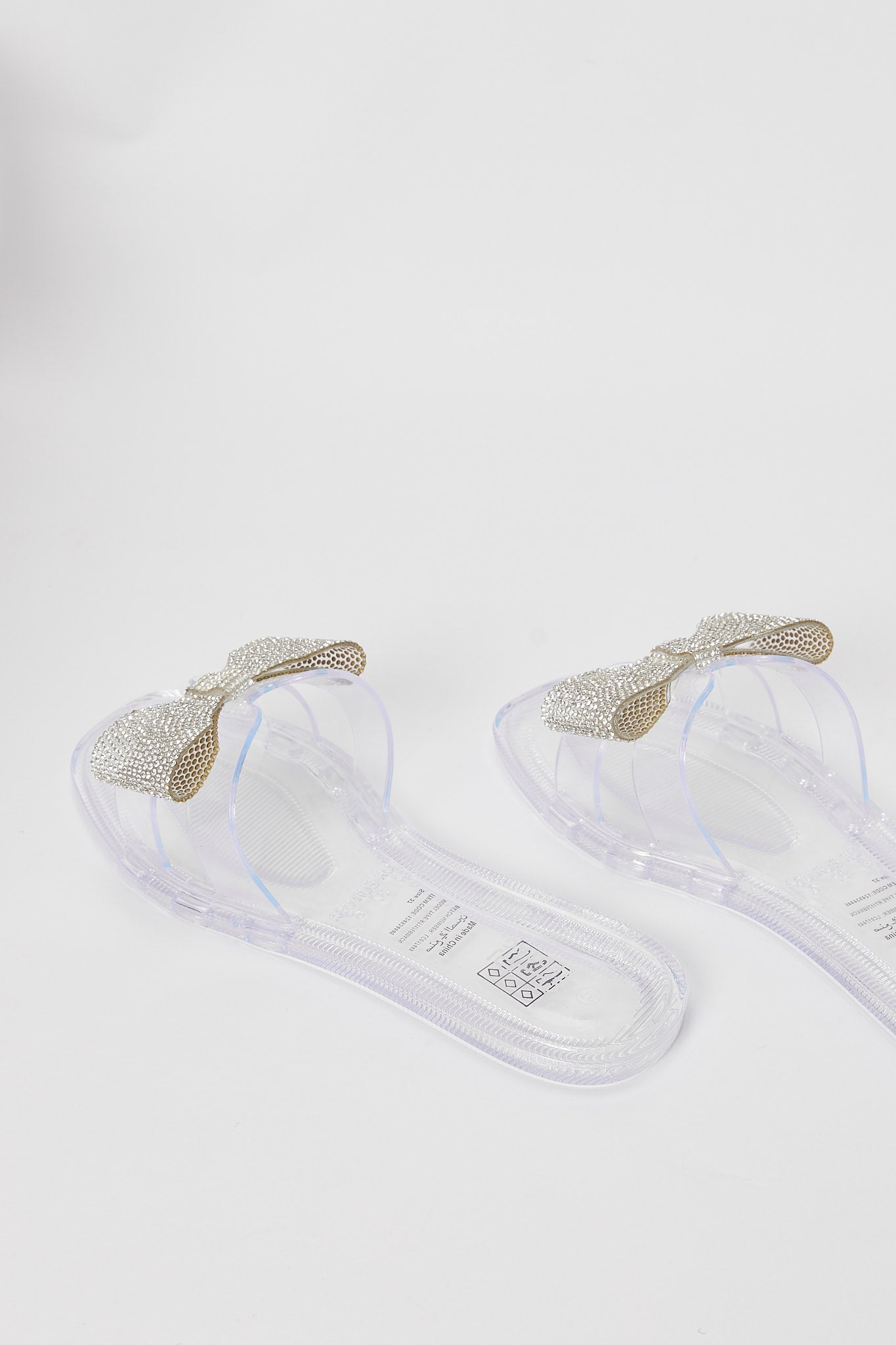 Redtag-Clear-Jelly-With-Diamante-Bow-Trim-Category:Shoes,-Colour:White,-Deals:New-In,-Filter:Women's-Footwear,-H1:FOO,-H2:LAD,-H3:SAF,-H4:FLF,-New-In-Women-FOO,-Non-Sale,-Promo:RMD,-RMD,-S23B,-Season:S23B,-Section:Women,-Women-Flip-Flops-Women's-