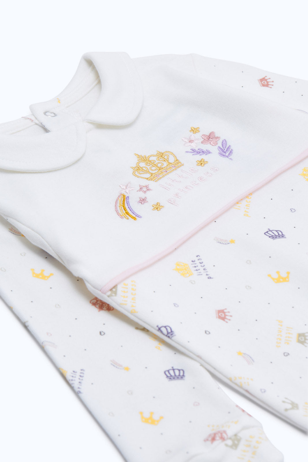 Redtag-White-Princess-Aop-Pink-Crown-Sleepsuit-Girl-Category:Sleepsuits,-Colour:Charcoal,-Deals:New-In,-Dept:New-Born,-Filter:Baby-(0-to-12-Mths),-H1:KWR,-H2:NBF,-H3:NWR,-H4:SST,-NBF-Sleepsuits,-New-In-NBF-APL,-Non-Sale,-RMD,-S23C,-Season:S23C,-Section:Boys-(0-to-14Yrs)-Baby-0 to 12 Months