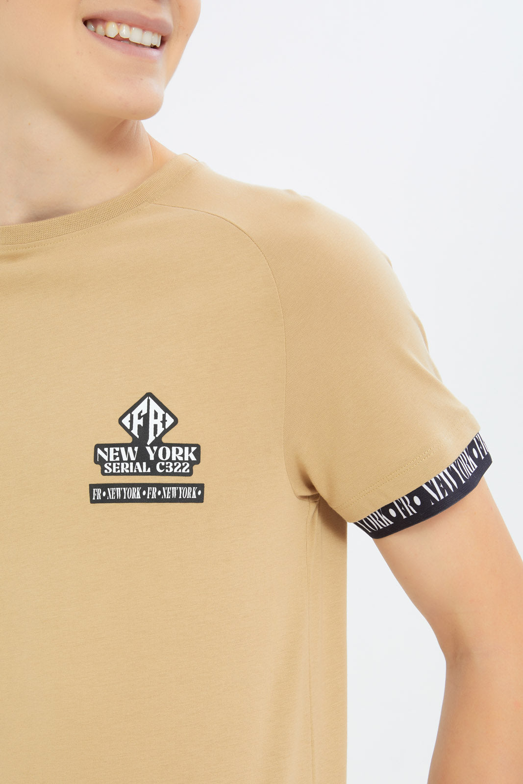 Redtag-Boys-Beige-Tape-On-Sleeve-Cuff-Tee-BSR-T-Shirts,-Category:T-Shirts,-Colour:Beige,-Deals:New-In,-Dept:Boys,-Filter:Senior-Boys-(8-to-14-Yrs),-H1:KWR,-H2:BSR,-H3:TSH,-H4:TSH,-New-In-BSR-APL,-Non-Sale,-S23C,-Season:S23C,-Section:Boys-(0-to-14Yrs)-Senior-Boys-9 to 14 Years