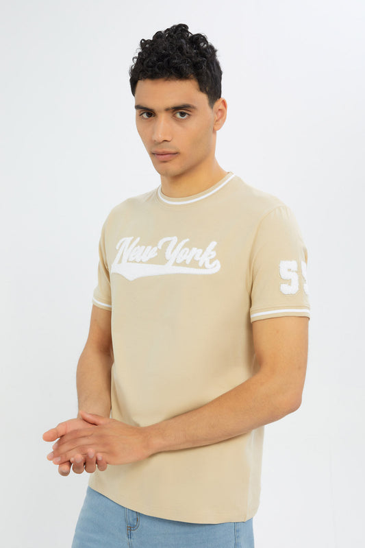Redtag-Men-Beige-Varsity-T-Shirt-With-Applique-Category:T-Shirts,-Colour:Beige,-Deals:New-In,-Filter:Men's-Clothing,-H1:MWR,-H2:GEN,-H3:TSH,-H4:TSH,-Men-T-Shirts,-New-In-Men-APL,-Non-Sale,-S23C,-Season:S23C,-Section:Men-Men's-