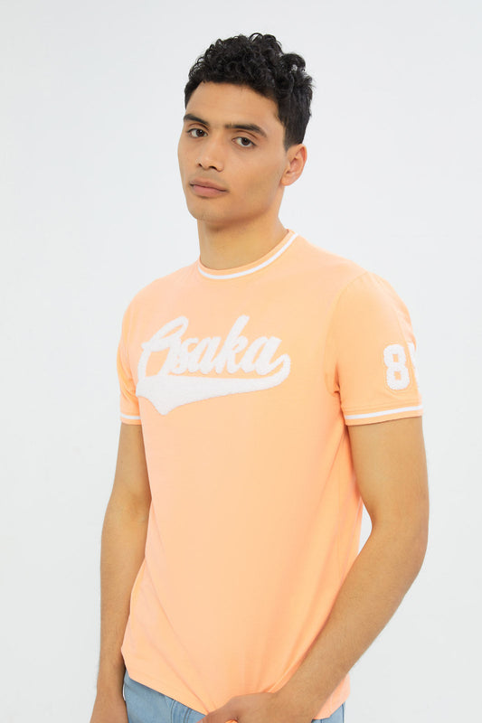 Redtag-Men-Orange-Varsity-T-Shirt-With-Applique-Category:T-Shirts,-Colour:Orange,-Deals:New-In,-Filter:Men's-Clothing,-H1:MWR,-H2:GEN,-H3:TSH,-H4:TSH,-Men-T-Shirts,-New-In-Men-APL,-Non-Sale,-S23C,-Season:S23C,-Section:Men-Men's-
