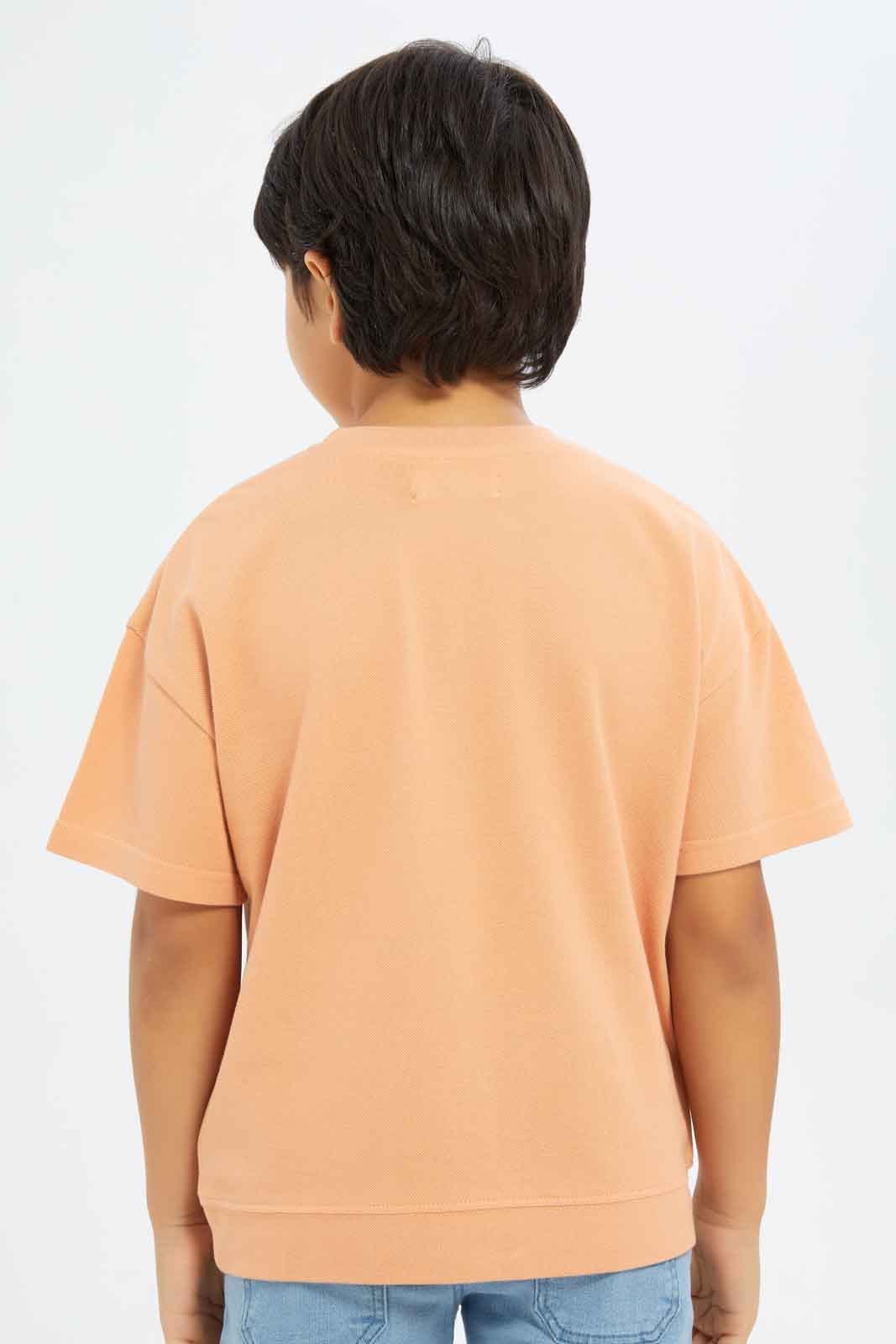 Redtag-Boys-Orange-Embroidered-Short-Sleeve-Oversize-Pique-T-Shirt-BOY-T-Shirts,-Category:T-Shirts,-Colour:Orange,-Deals:New-In,-Filter:Boys-(2-to-8-Yrs),-New-In-BOY-APL,-Non-Sale,-S23C,-Section:Boys-(0-to-14Yrs),-TBL-Boys-2 to 8 Years
