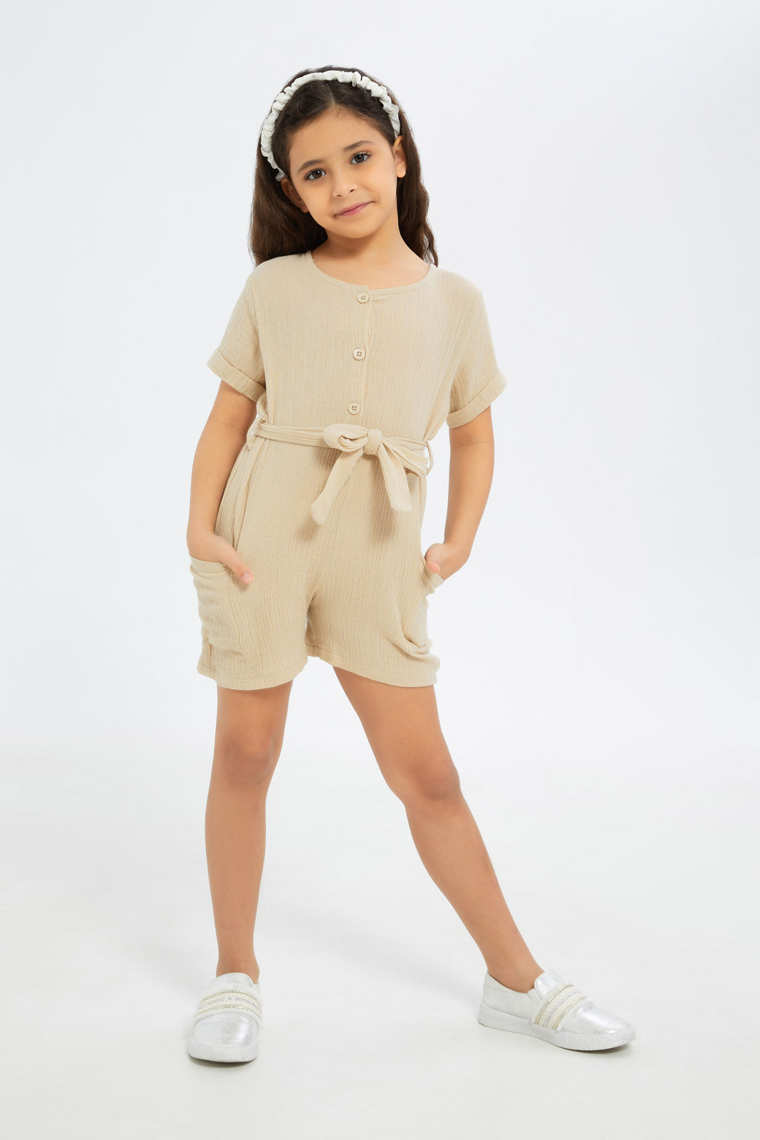 Redtag-Girls-Beige-Dobby-Playsuit-Category:Jumpsuits,-Colour:Beige,-Deals:New-In,-Filter:Girls-(2-to-8-Yrs),-GIR-Jumpsuits,-H1:KWR,-H2:GIR,-H3:SET,-H4:JMS,-New-In-GIR-APL,-Non-Sale,-S23B,-Season:S23B,-Section:Girls-(0-to-14Yrs)-Girls-2 to 8 Years