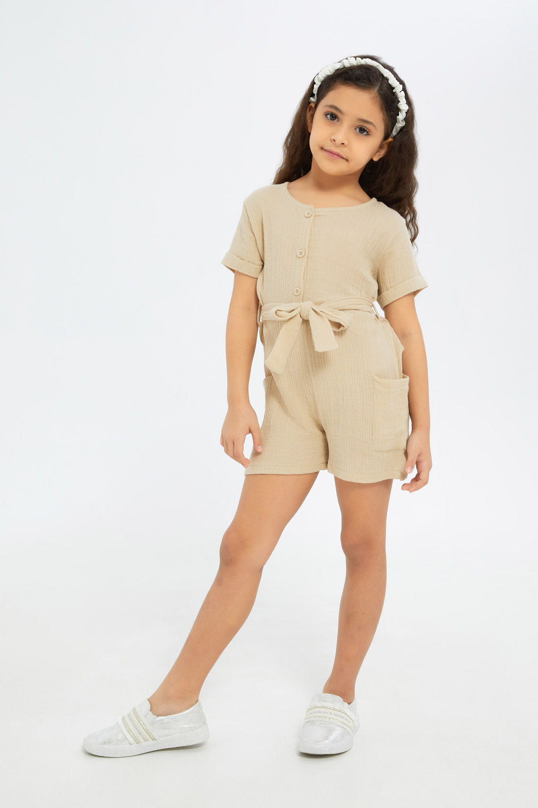 Redtag-Girls-Beige-Dobby-Playsuit-Category:Jumpsuits,-Colour:Beige,-Deals:New-In,-Filter:Girls-(2-to-8-Yrs),-GIR-Jumpsuits,-H1:KWR,-H2:GIR,-H3:SET,-H4:JMS,-New-In-GIR-APL,-Non-Sale,-S23B,-Season:S23B,-Section:Girls-(0-to-14Yrs)-Girls-2 to 8 Years