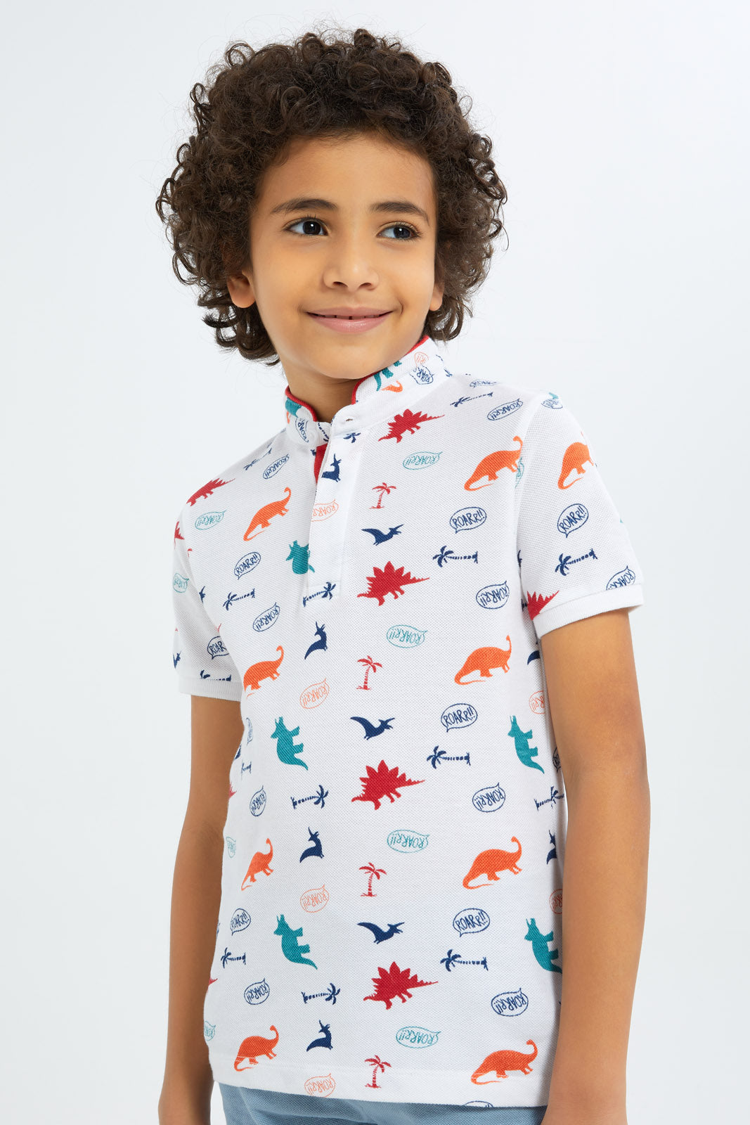 Redtag-Boys-White-Dino-Allover-Print-Stand-Up-Collar-Polo-Shirt-BOY-Polo-T-Shirts,-Category:Polo-T-Shirts,-Colour:White,-Deals:New-In,-Filter:Boys-(2-to-8-Yrs),-New-In-BOY-APL,-Non-Sale,-S23C,-Section:Boys-(0-to-14Yrs),-TBL-Boys-2 to 8 Years