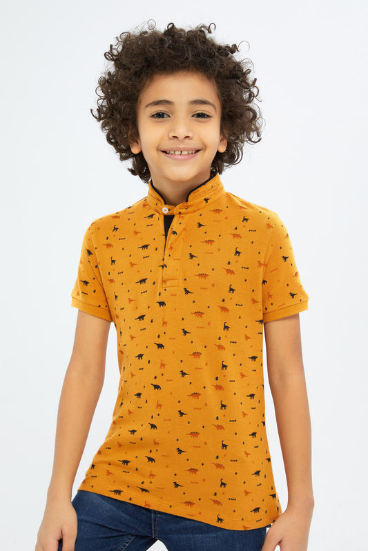 Redtag-Boys-Brown-Dino-Allover-Print-Stand-Up-Collar-Polo-Shirt-BOY-Polo-T-Shirts,-Category:Polo-T-Shirts,-Colour:Brown,-Deals:New-In,-Filter:Boys-(2-to-8-Yrs),-New-In-BOY-APL,-Non-Sale,-S23C,-Section:Boys-(0-to-14Yrs),-TBL-Boys-2 to 8 Years