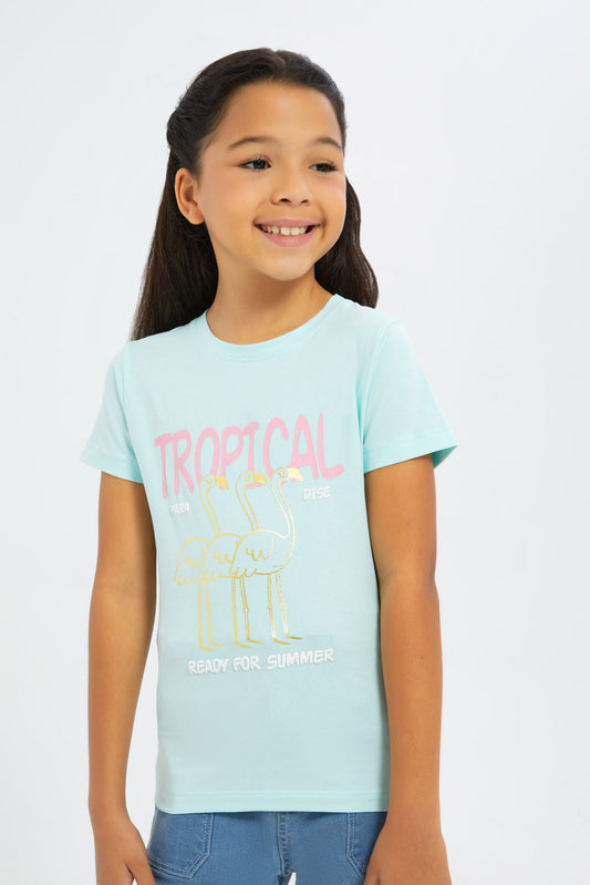 Redtag-Girls-Blue-"Tropical"-Foil-Print-Tshirt-Category:T-Shirts,-Colour:Blue,-Deals:New-In,-Filter:Girls-(2-to-8-Yrs),-GIR-T-Shirts,-H1:KWR,-H2:GIR,-H3:TSH,-H4:CAT,-New-In-GIR-APL,-Non-Sale,-S23C,-Season:S23C,-Section:Girls-(0-to-14Yrs),-TBL-Girls-2 to 8 Years
