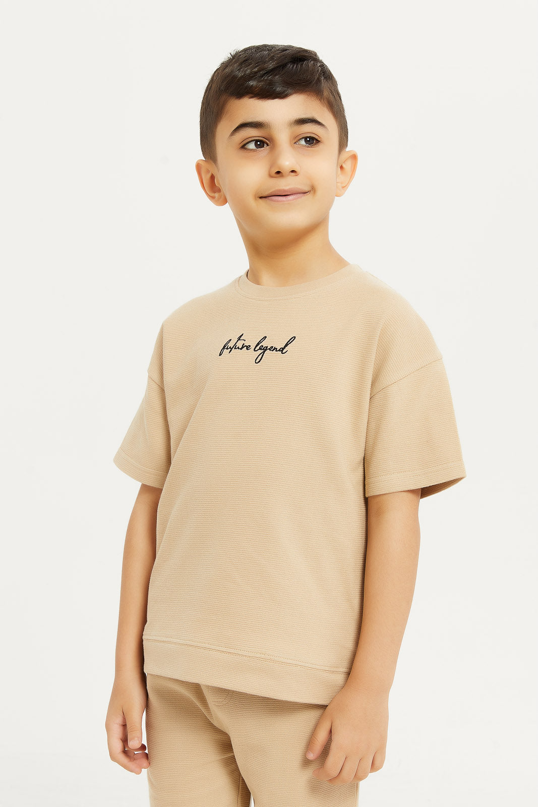 Redtag-Boys-Ecru-Jaquard-Oversized-T-Shirt-BOY-T-Shirts,-Category:T-Shirts,-Colour:Ecru,-Deals:New-In,-Filter:Boys-(2-to-8-Yrs),-H1:KWR,-H2:BOY,-H3:TSH,-H4:TSH,-KWRBOYTSHTSH,-New-In-BOY-APL,-Non-Sale,-Promo:TBL,-S23D,-Season:S23D,-Section:Boys-(0-to-14Yrs),-TBL-Boys-2 to 8 Years
