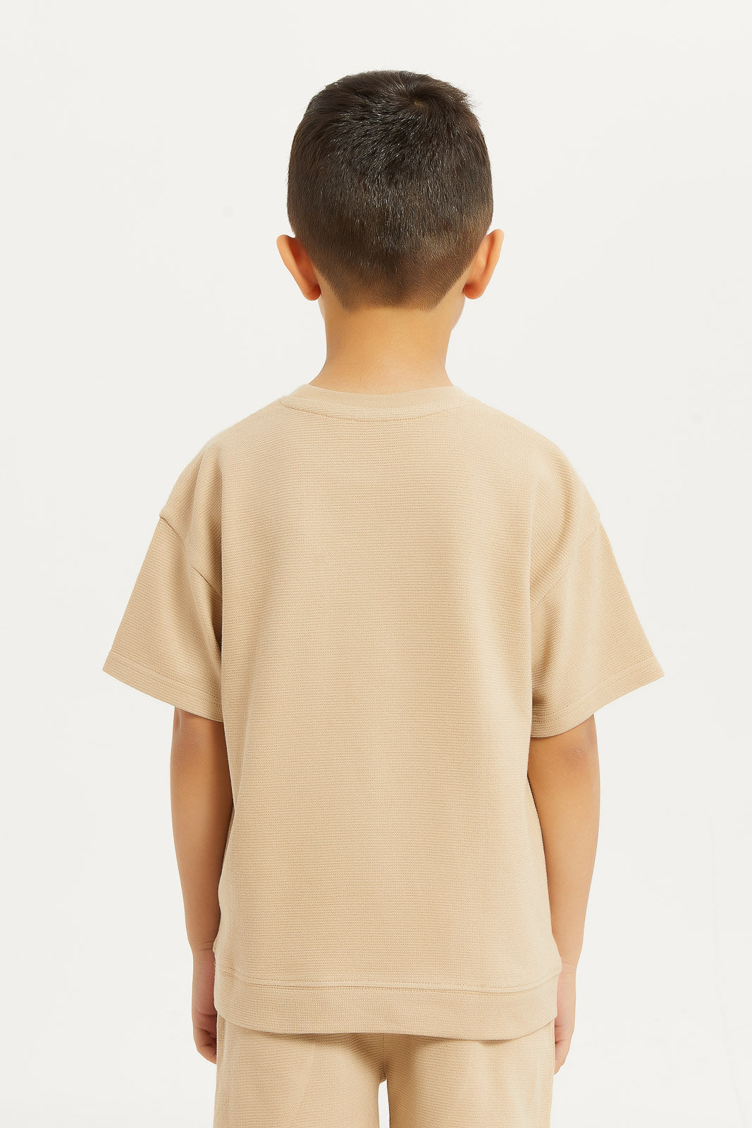 Redtag-Boys-Ecru-Jaquard-Oversized-T-Shirt-BOY-T-Shirts,-Category:T-Shirts,-Colour:Ecru,-Deals:New-In,-Filter:Boys-(2-to-8-Yrs),-H1:KWR,-H2:BOY,-H3:TSH,-H4:TSH,-KWRBOYTSHTSH,-New-In-BOY-APL,-Non-Sale,-Promo:TBL,-S23D,-Season:S23D,-Section:Boys-(0-to-14Yrs),-TBL-Boys-2 to 8 Years